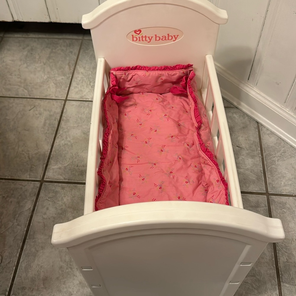 Retired Bitty baby crib with bumper/mattress insert.